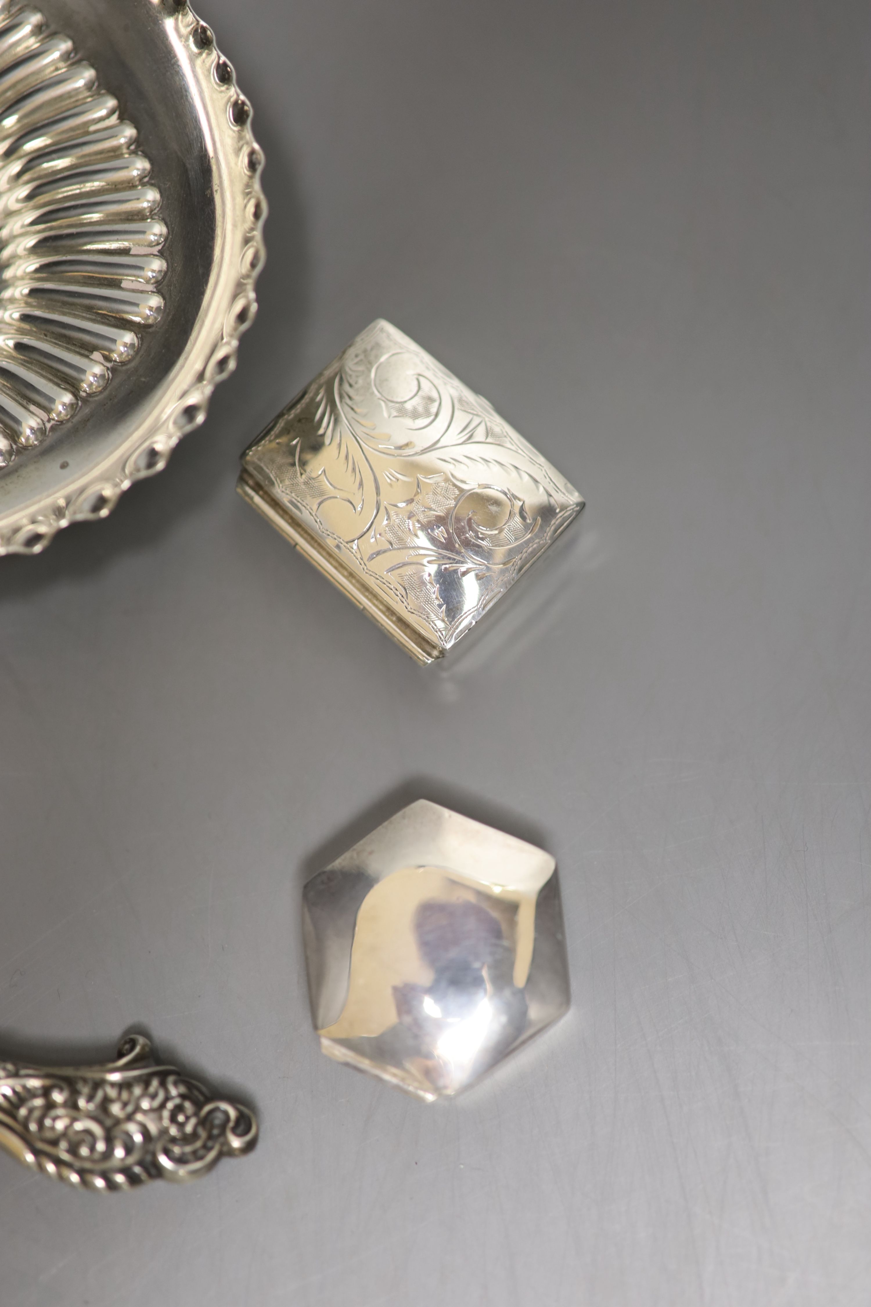 A late Victorian demi-fluted oval dish, London, 1897, 15.2cm, a silver handled paper knife & 5 boxers.